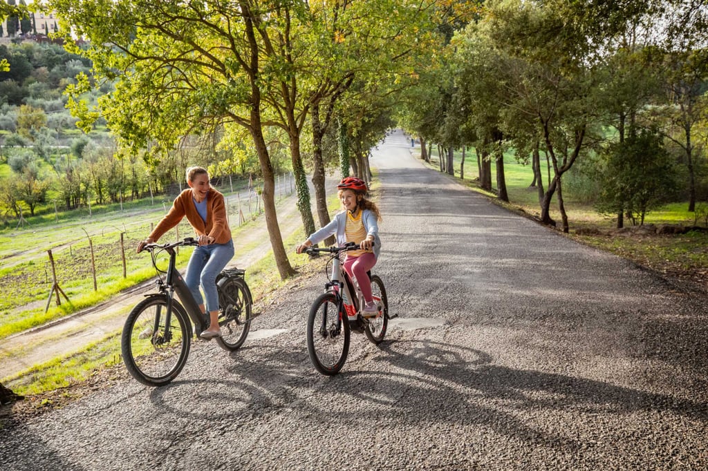 family biking through Tuscany
