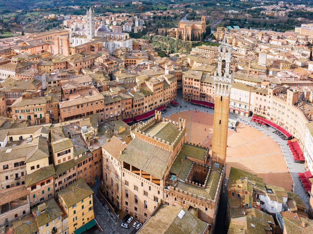 An aerial view of Siena cityscape surrounded by buildings