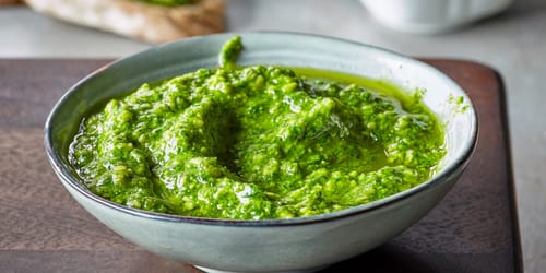 bowl of basil pesto, selective focus