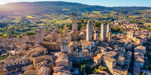 Town of San Gimignano, Tuscany, Italy with its famous medieval towers. Aerial view of the medieval village of San Gimignano, a Unesco World Heritage Site. Italy, Tuscany, Val d'Elsa.