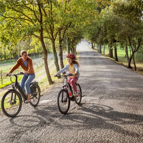 family biking through Tuscany