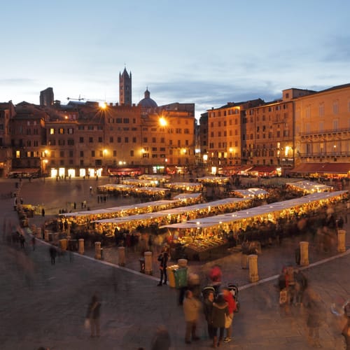 Traditional Mercato Grande, historic craft and food market on main market square ( il Campo ) in Siena, Tuscany, Italy, Europe