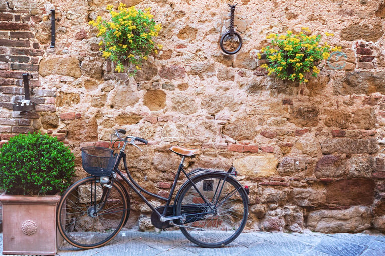bike standing at the empty street of old italian town. Pienza, Tuscany, Italy